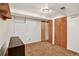 A finished basement with wood-trimmed closets, neutral walls, and carpeted floors at 8721 W 86Th Ave, Arvada, CO 80005