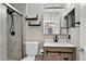 A bathroom featuring a glass shower, modern fixtures, and contemporary decor at 8721 W 86Th Ave, Arvada, CO 80005