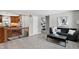 Inviting living room with easy access to the kitchen and an expansive view of a bedroom at 8721 W 86Th Ave, Arvada, CO 80005