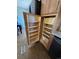Kitchen pantry features pull-out shelves for easy storage and organization at 8721 W 86Th Ave, Arvada, CO 80005