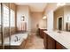 Main bathroom with double vanity and large soaking tub at 15735 Carob Cir, Parker, CO 80134