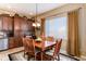 Cozy dining area adjacent to kitchen with lots of natural light at 15735 Carob Cir, Parker, CO 80134