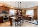 Open concept kitchen and dining area with hardwood floors and lots of natural light at 15735 Carob Cir, Parker, CO 80134