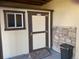 Tan and brown storage shed with a small ramp at 15735 Carob Cir, Parker, CO 80134