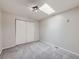 Bright bedroom with neutral walls, carpet flooring, and a skylight at 5300 E Cherry Creek South Dr # 620, Denver, CO 80246