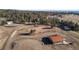 Aerial view of property with arena, barn, shop, and house at 7076 Inspiration Dr, Parker, CO 80138