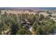 Aerial view showing home nestled among trees with pool visible at 7076 Inspiration Dr, Parker, CO 80138