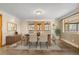 Dining room with glass table and access to back porch at 7076 Inspiration Dr, Parker, CO 80138
