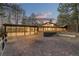 Back exterior view of mid-century home with screened patio at 7076 Inspiration Dr, Parker, CO 80138