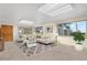Spacious living room with two sofas, coffee table, and large windows at 7076 Inspiration Dr, Parker, CO 80138