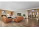 Open living room with hardwood floors and views to dining area at 7076 Inspiration Dr, Parker, CO 80138