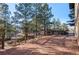 Brick patio with wooden railing and seating area at 7076 Inspiration Dr, Parker, CO 80138