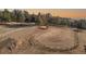 Aerial view of a riding arena with surrounding landscape at 7076 Inspiration Dr, Parker, CO 80138