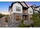 Beautiful townhome exterior with stone accents, multiple decks, and modern design at 7022 Homeplace St, Castle Rock, CO 80108