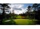 Beautiful green golf course with mature trees and challenging play that enhances leisure time at 7022 Homeplace St, Castle Rock, CO 80108