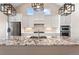 Open kitchen with granite countertops, stainless steel appliances, pendant lighting, and white cabinetry at 7022 Homeplace St, Castle Rock, CO 80108