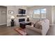 Cozy living room with stone fireplace, modern mantel, and plush sofa creating an inviting atmosphere at 7022 Homeplace St, Castle Rock, CO 80108