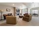Spacious living room with a modern fireplace, plush seating, and lots of natural light at 7022 Homeplace St, Castle Rock, CO 80108