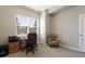 Inviting home office with a desk, comfortable chair, and a large window for natural light at 7022 Homeplace St, Castle Rock, CO 80108