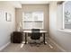 Bright office space with a large window, desk, and stylish modern furnishings at 7022 Homeplace St, Castle Rock, CO 80108