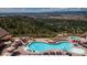 Stunning community pool with lounge chairs offers a relaxing and luxurious experience at 7022 Homeplace St, Castle Rock, CO 80108