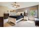 Relaxing main bedroom with vaulted ceilings, dual windows, and a stylish bed at 13330 York Way, Thornton, CO 80241