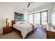 Bright bedroom featuring a large window, comfortable king-size bed, and stylish decor at 1750 Wewatta St # 627, Denver, CO 80202