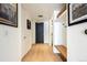 Entryway with hardwood floors, storage, hall closet and a modern design at 1750 Wewatta St # 627, Denver, CO 80202