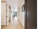 Bright hallway with hardwood floors, storage cabinets and modern fixtures for comfortable living at 1750 Wewatta St # 627, Denver, CO 80202