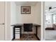 Home office with modern desk setup and view of the bedroom at 1750 Wewatta St # 627, Denver, CO 80202
