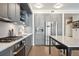 Contemporary kitchen with stainless steel appliances, gray cabinets, and modern fixtures at 1750 Wewatta St # 627, Denver, CO 80202