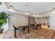 Cozy library room with bookshelves, tables, chairs, and vibrant rug at 1750 Wewatta St # 627, Denver, CO 80202