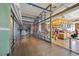 Modern restaurant space with glass walls, a counter, and an open kitchen concept at 1750 Wewatta St # 627, Denver, CO 80202