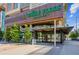 A Whole Foods Market in a modern building with sidewalk seating and nearby retail at 1750 Wewatta St # 627, Denver, CO 80202