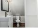 Bathroom includes modern vanity, toilet, and storage cabinet at 931 E 17Th Ave, Denver, CO 80218