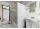 Bathroom featuring white tile floor, tub, shower, and vanity at 931 E 17Th Ave, Denver, CO 80218