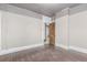 Bedroom with light gray wallpaper and doorway leading to another room at 931 E 17Th Ave, Denver, CO 80218