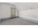 Cozy bedroom featuring a window, radiator, and neutral-toned carpet at 931 E 17Th Ave, Denver, CO 80218