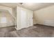 Room showcases hardwood floors, white walls, bright window, and two paneled white doors at 931 E 17Th Ave, Denver, CO 80218