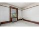 Bedroom with tall window and radiator with wood trim and views of the neighborhood at 931 E 17Th Ave, Denver, CO 80218