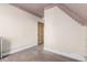 Quaint bedroom showing an old wooden door, trim, flooring, and ceiling with patterned border at 931 E 17Th Ave, Denver, CO 80218