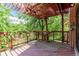 Wooden deck features pergola and overlooks the lush backyard at 931 E 17Th Ave, Denver, CO 80218