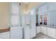 Efficient kitchen space with a built-in pantry and modern refrigerator at 931 E 17Th Ave, Denver, CO 80218