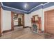 Charming living room featuring a decorative fireplace, hardwood floors, and classic architectural details at 931 E 17Th Ave, Denver, CO 80218