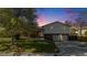 Charming two-story home featuring a well-maintained lawn, brick accents, and an attached two-car garage at 9345 W Iowa Pl, Lakewood, CO 80232