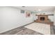 Cozy living room with brick fireplace and decorative mantle, wood-style flooring and natural light at 9345 W Iowa Pl, Lakewood, CO 80232