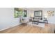 Cozy living room with neutral decor, hardwood floors, and ample natural light at 9345 W Iowa Pl, Lakewood, CO 80232