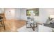 Bright living space with hardwood floors, neutral tones, and an abundance of natural light at 9345 W Iowa Pl, Lakewood, CO 80232