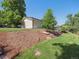 Charming backyard featuring a landscaped lawn, mature trees and shrubbery enhancing curb appeal at 11569 W 27Th Ave, Lakewood, CO 80215