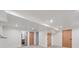 Finished basement featuring recessed lighting, carpet floors, neutral tones, and multiple doors leading to other rooms at 11569 W 27Th Ave, Lakewood, CO 80215